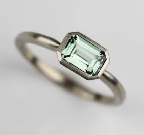 East West Bezel Solitaire Engagement Ring with Lab-grown Light Green Sapphire