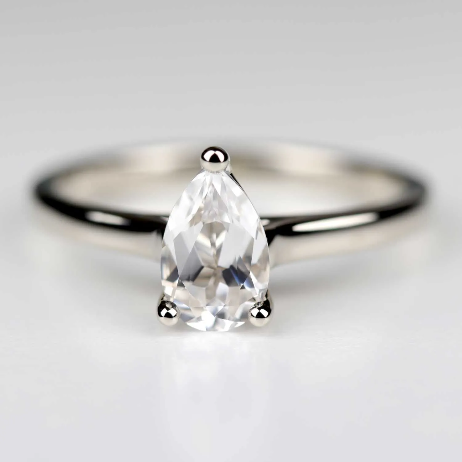 Pear Cut Lab-grown White Sapphire Cathedral Solitaire